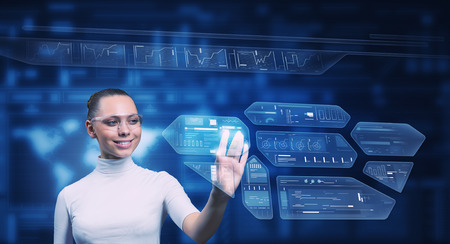 Virtual holographic interface used by young pretty woman