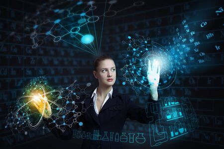 Attractive smiling businesswoman working with virtual panel interface