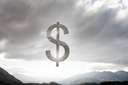 Financial concept with stone dollar symbol on natural landscapeの写真素材