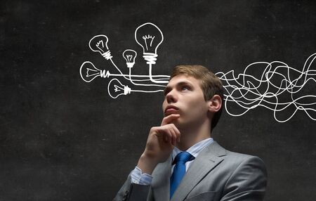 Thoughtful businessman with arrows and thoughts coming out of his head