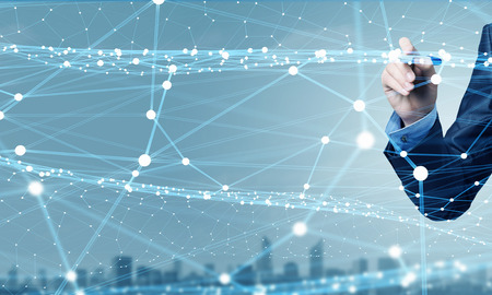 Businessman hand drawing digital connection lines on virtual screenの写真素材