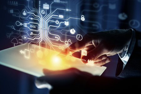Close up of businessperson using tablet representing cloud computing concept