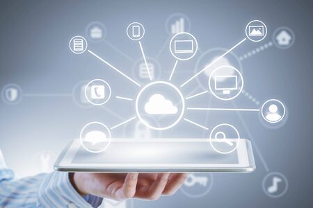 Close up of businessperson using tablet representing cloud computing concept