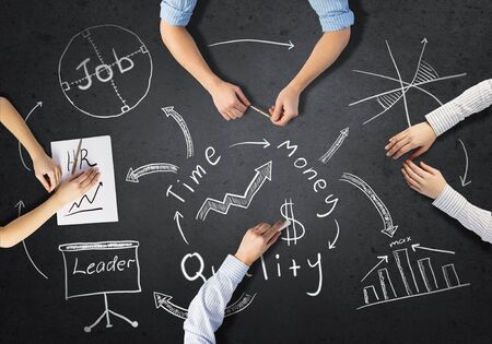 Top view of people hands drawing business teamwork strategyの写真素材