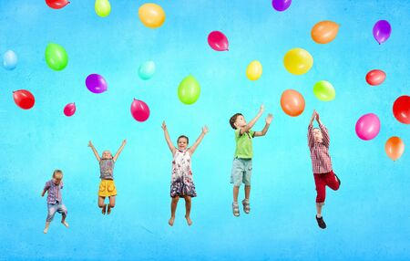 Group of happy children playing with colorful balloonsの写真素材