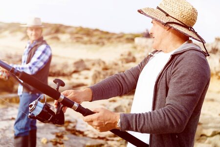 Picture of fisherman fishing with rods