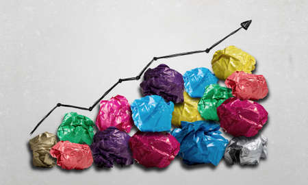 Set of colourful crumpled paper balls on grey surface