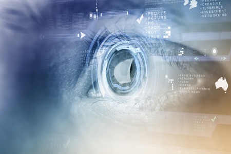 Close up of human eye on digital technology backgroundの写真素材