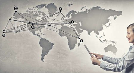 Young beautiful woman using tablet as symbol of modern technologyの写真素材