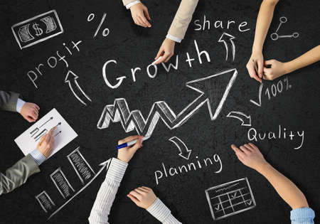 Top view of people hands drawing business strategy successful planの写真素材