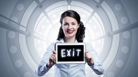 Elegant brunette in virtual interior showing tablet pc with conceptの写真素材