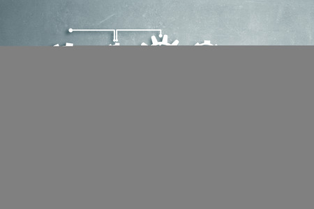 Back view of businesswoman standing with back and drawing gears mechanism