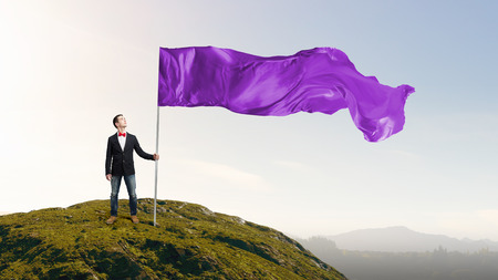 Student guy in casual with flag in handsの写真素材