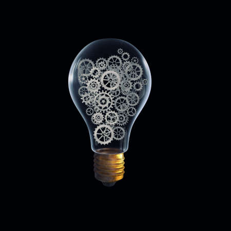 Glass light bulb with gears inside on dark backgroundの写真素材