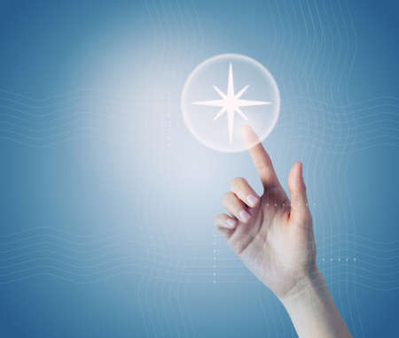 Close up of hand touching location icon on media screen