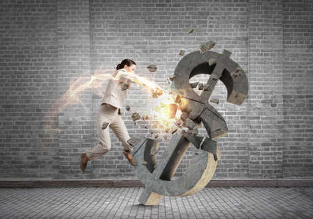 Emotional businesswoman breaking with hand stone dollar symbol