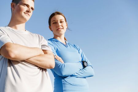 Young couple on beach training and exercising togetherの写真素材