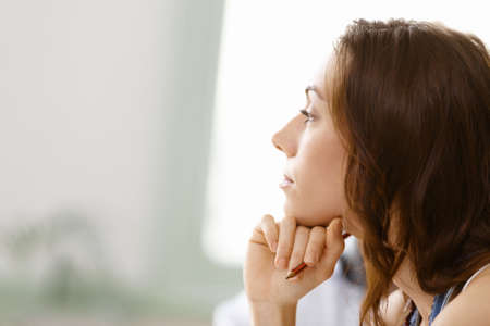 Young pretty woman smiling portrait indoorsの写真素材
