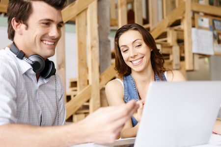 Start-up Team of two young people in officeの写真素材