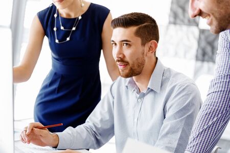 Business people working and discussing in modern officeの写真素材