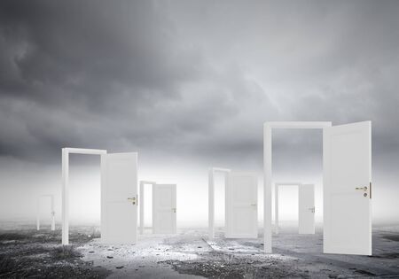 Home white opened door against natural landscapeの写真素材