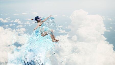 Kid girl of school age in diving mask having funの写真素材