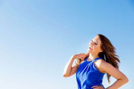 Portrait of young pretty woman on summer day on the beachの写真素材
