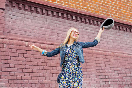 Happy tourist girl walking on city historic street