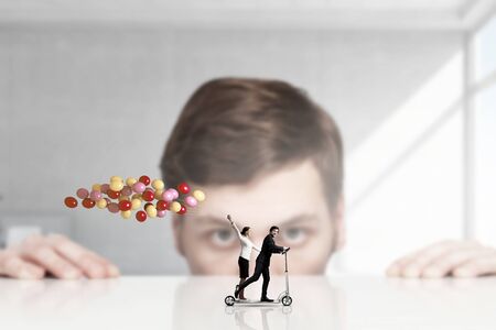 Happy careless business people under intent look of bossの写真素材