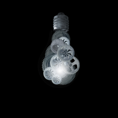 Light bulb with gears inside on dark backgroundの写真素材