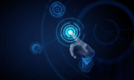 Hand of businessman on dark background touching icon of media screen