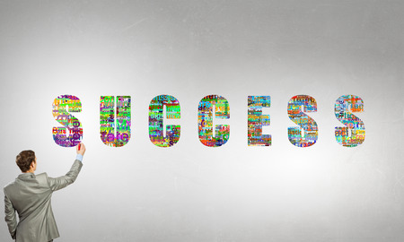 Rear view of businessman writing leadership and success conceptsの写真素材