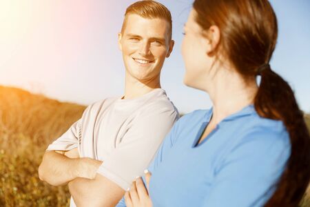 Young couple on beach wearing sportwearの写真素材