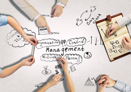 Top view of people hands drawing business strategy successful planの写真素材