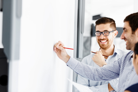 Business people working and discussing in modern officeの写真素材