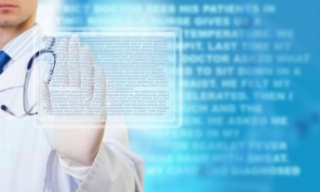 Close view of male doctor touching icon of media screenの写真素材