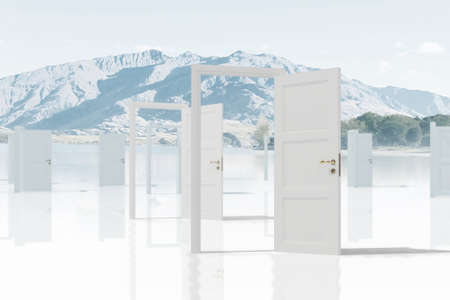 Home white opened door against natural landscapeの写真素材