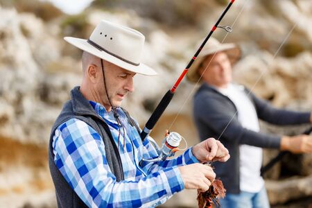 Picture of fishermen fishing with rods