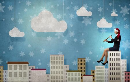 Woman in formal suit and Santa hat looking in spyglassの写真素材