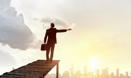 Businessman standing on dock and enjoying the viewの写真素材