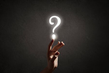 Person hand touching with finger question signの写真素材