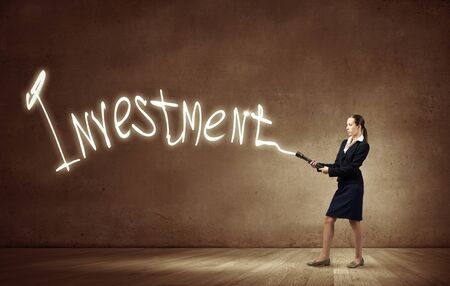 Woman drawing with lantern light business conceptual wordsの写真素材