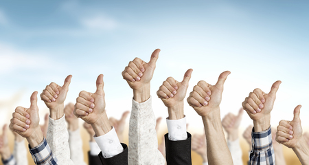 Many different people hands in line raised upの写真素材