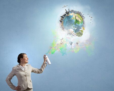 Young elegant businesswoman with white spray balloon in hand.