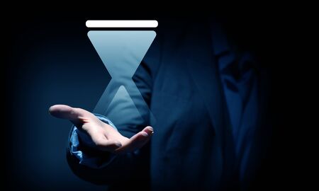 Close up of businesswoman hand holding digital icon in palm