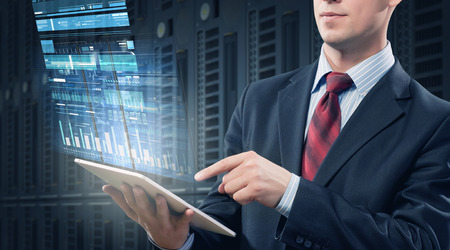 Close view of elegant businessman using tablet deviceの写真素材