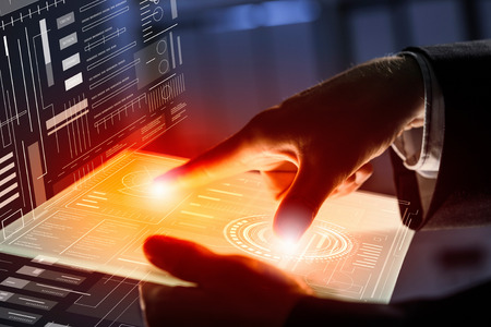 Close view of businessman touching screen of tablet or virtual panel