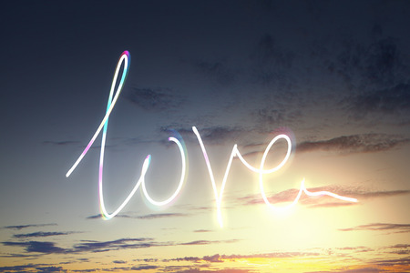 Evening sky and love heart sign drawn with lightの写真素材