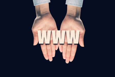 Male hands on dark background showing in palms conceptual wordの写真素材