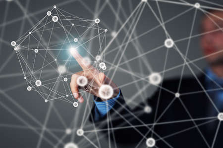 Businessman hand touching with finger digital connection lines on virtual screenの写真素材